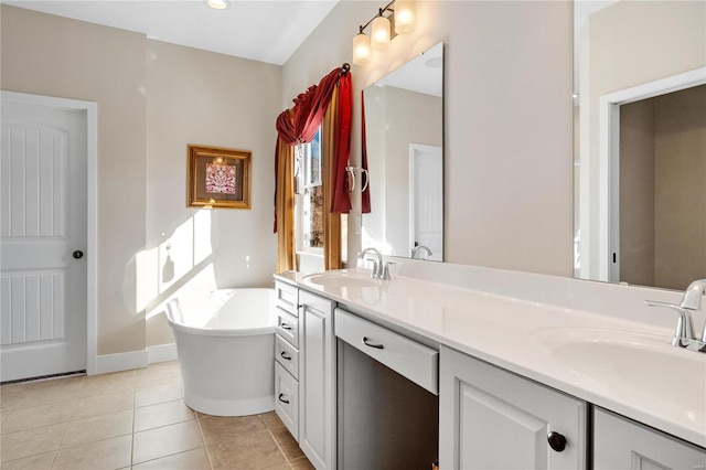 bathroom featuring vanity, a tub to relax in, and tile patterned floors