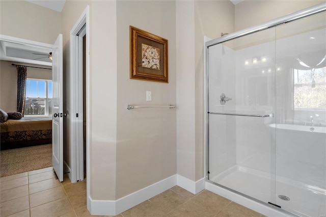 bathroom with tile patterned floors, ceiling fan, and an enclosed shower