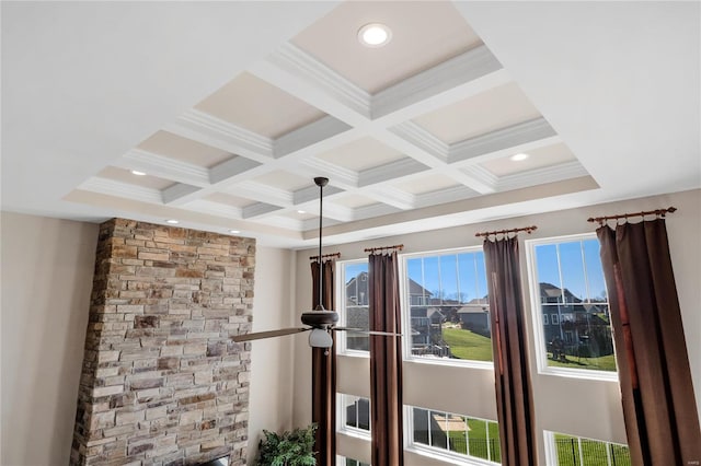 interior details featuring beamed ceiling, crown molding, and coffered ceiling