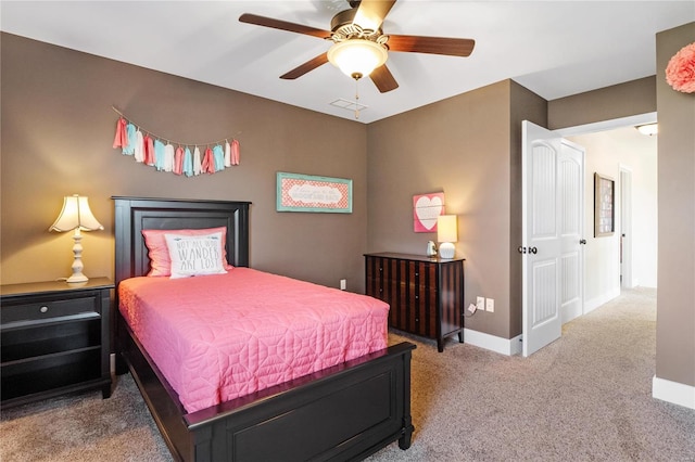 carpeted bedroom with ceiling fan