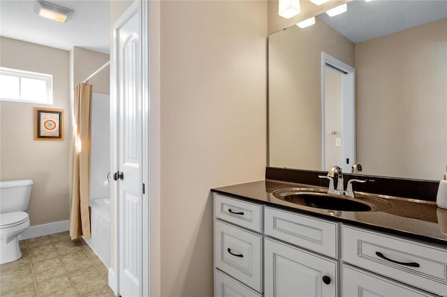 full bathroom featuring tile patterned floors, vanity, toilet, and shower / tub combo with curtain