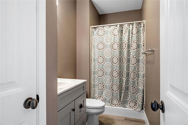 bathroom featuring hardwood / wood-style floors, vanity, and toilet