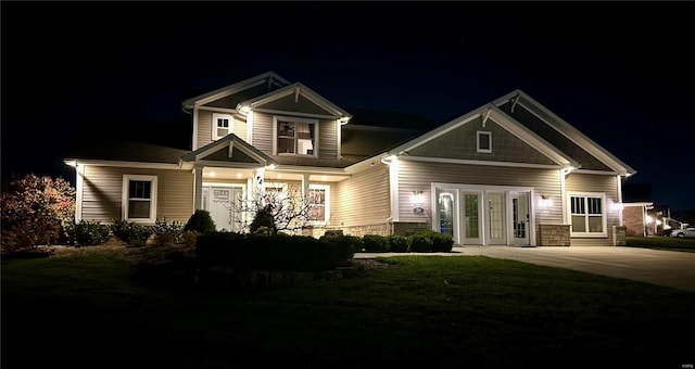 craftsman-style house with a lawn