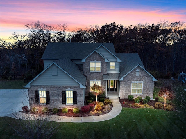 view of front of property with a lawn