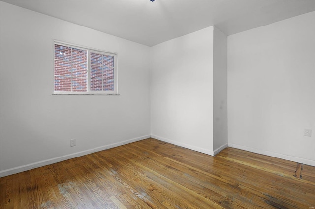 empty room featuring wood-type flooring