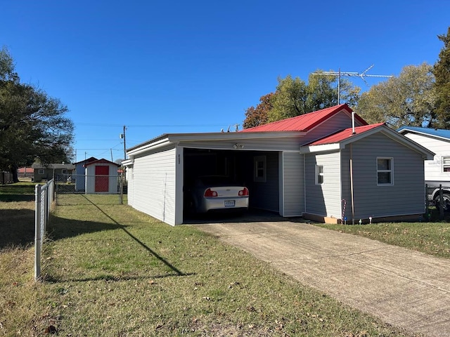 view of side of home featuring a yard and a carport