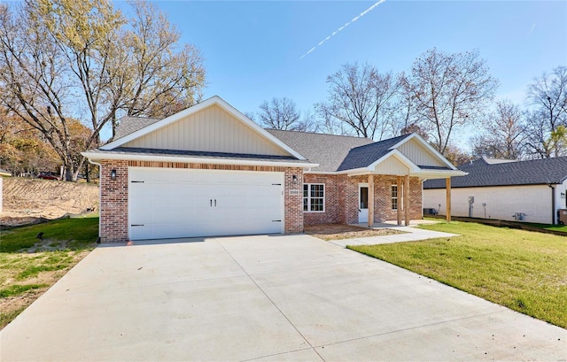 view of front of home featuring a front lawn and a garage