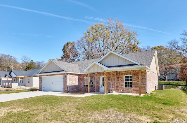 view of front of house featuring a garage, a front lawn, and cooling unit