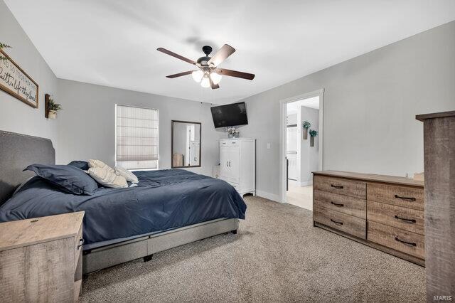 bedroom featuring light colored carpet and ceiling fan