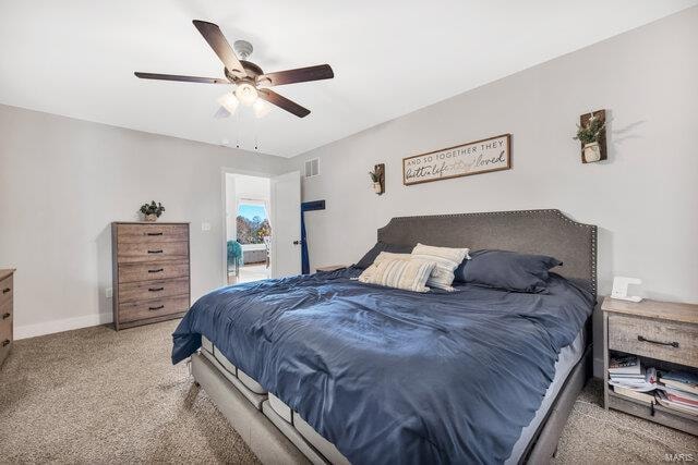 carpeted bedroom with ceiling fan