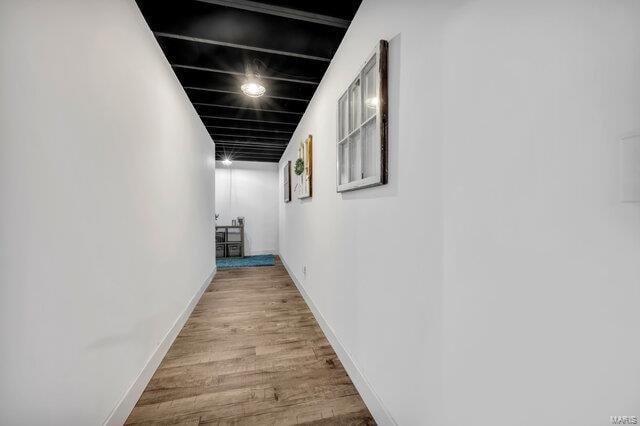 hall with light hardwood / wood-style floors