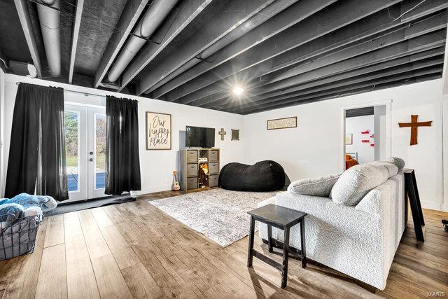 living room featuring hardwood / wood-style flooring and french doors