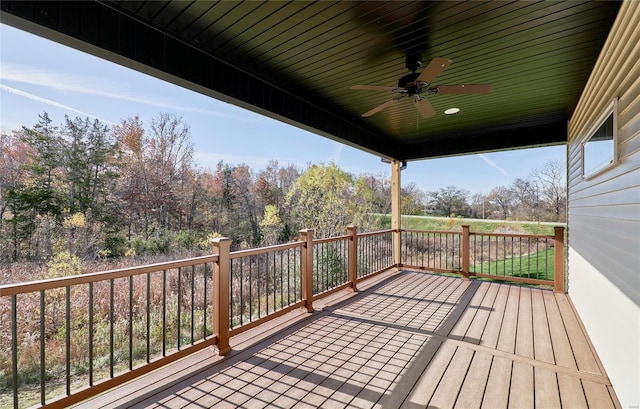 wooden terrace featuring ceiling fan