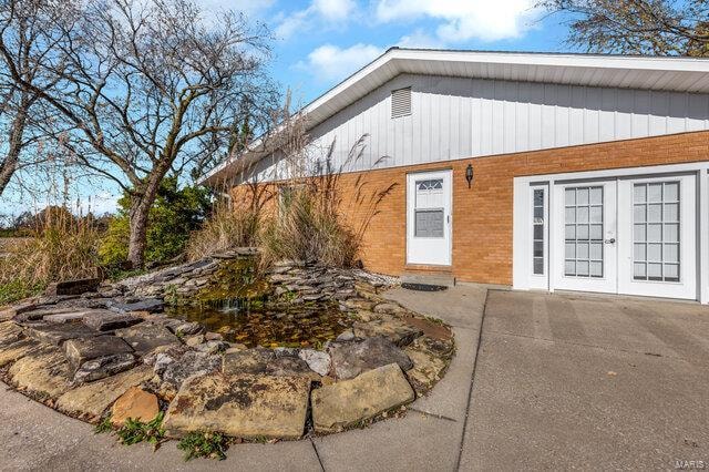 exterior space featuring a patio and french doors