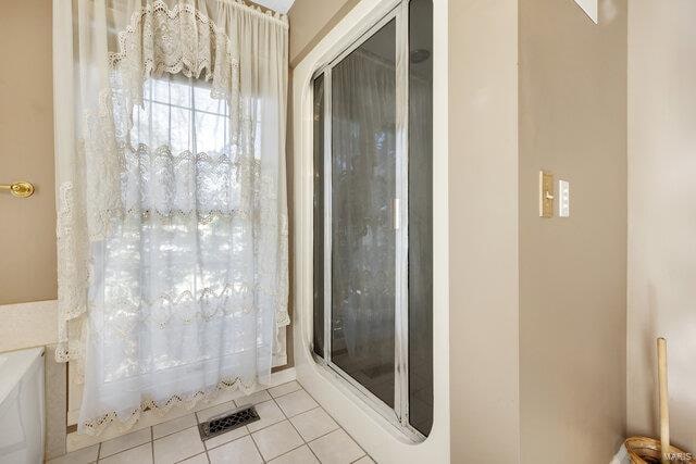 bathroom featuring tile patterned flooring