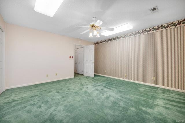 unfurnished bedroom with carpet flooring and ceiling fan