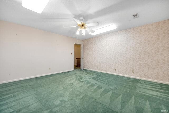 empty room with carpet flooring