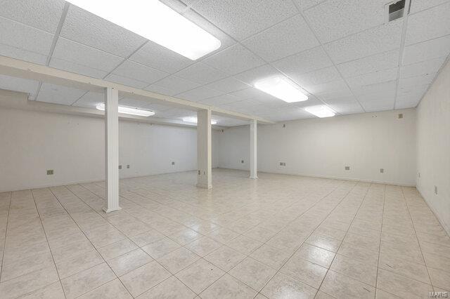 basement featuring a drop ceiling