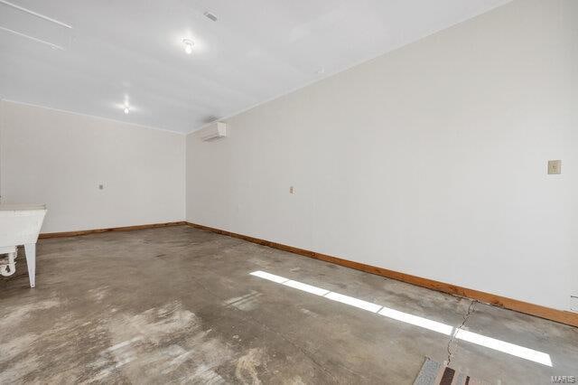 empty room with concrete flooring