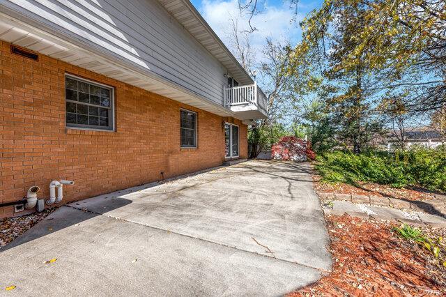 view of property exterior with a balcony