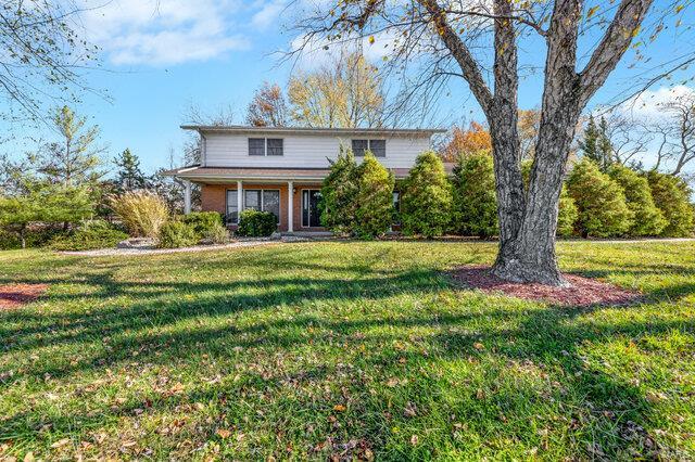 view of property with a front lawn