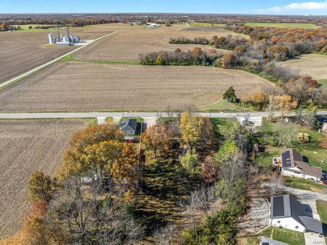 birds eye view of property featuring a rural view