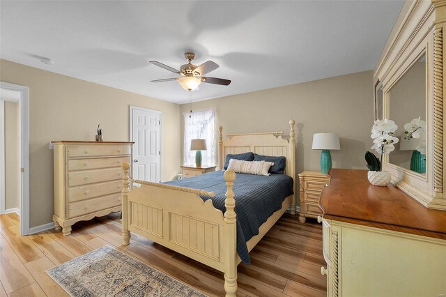 bedroom with ceiling fan and light hardwood / wood-style flooring