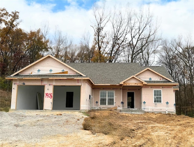 unfinished property featuring a garage