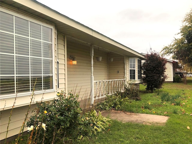 view of property exterior with a porch