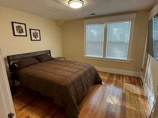 bedroom with light hardwood / wood-style floors