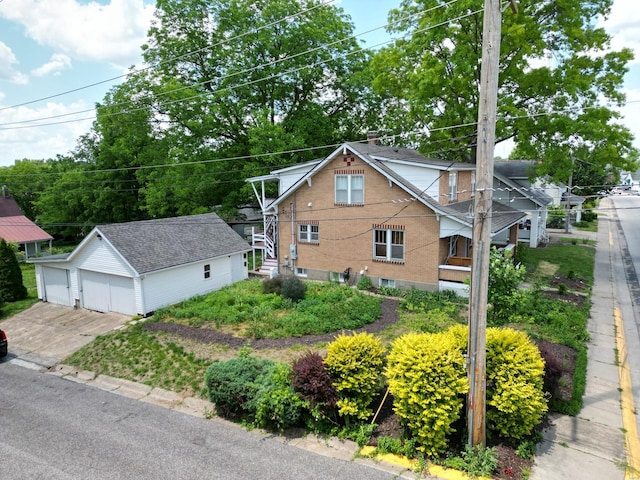 view of front facade with a garage and an outdoor structure