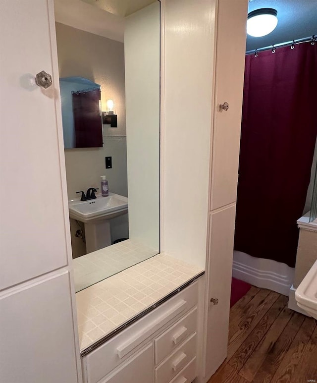 bathroom featuring sink and hardwood / wood-style flooring