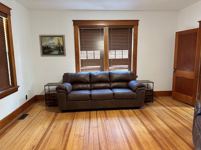 living room with light hardwood / wood-style floors