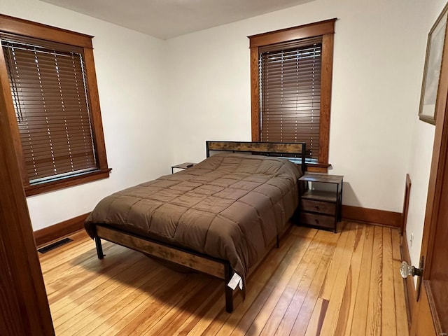 bedroom with light hardwood / wood-style floors