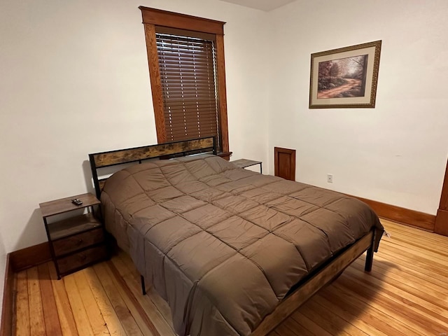 bedroom with light wood-type flooring