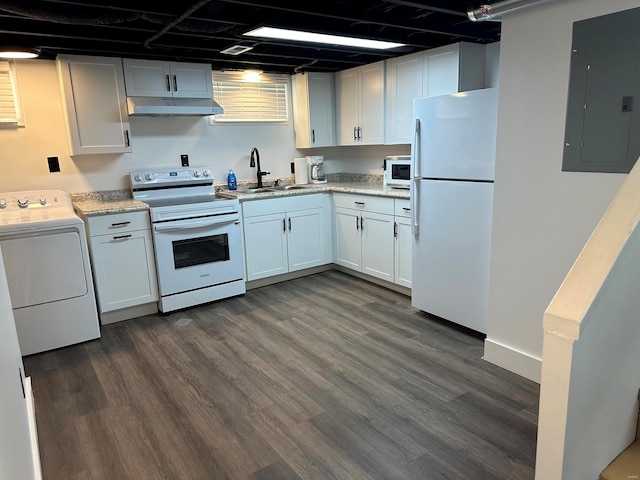 kitchen featuring electric panel, dark hardwood / wood-style flooring, white appliances, and washer / dryer