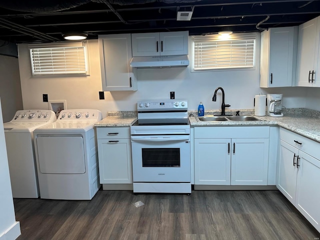 kitchen featuring washer and dryer, electric stove, white cabinets, and sink