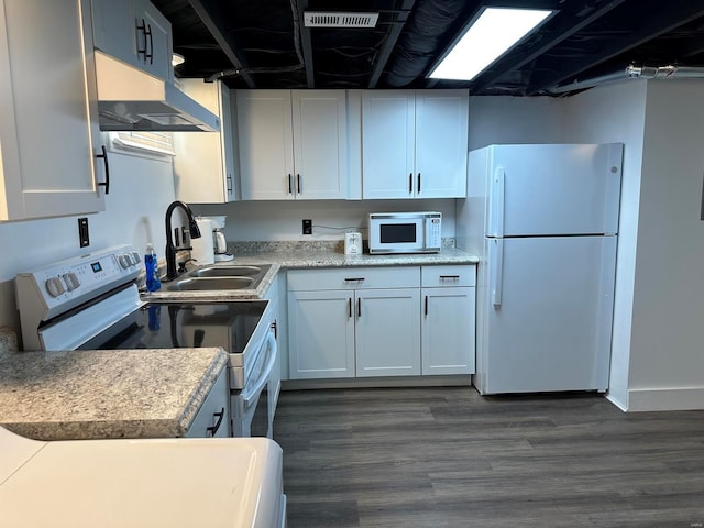 kitchen with white cabinets, dark hardwood / wood-style floors, white appliances, and sink