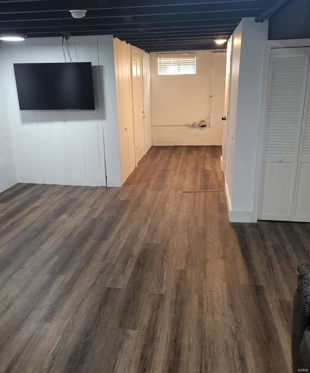 basement with dark wood-type flooring