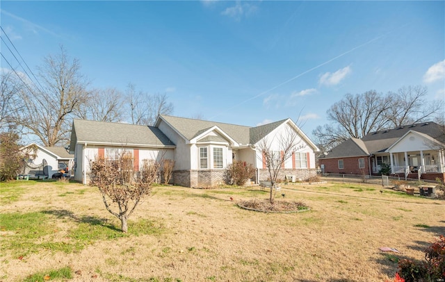 ranch-style house with a front yard