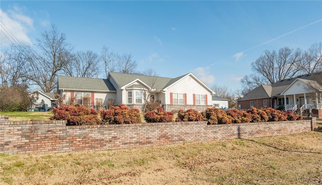 ranch-style house with a front yard