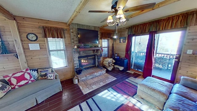 living room featuring a wealth of natural light and wood walls