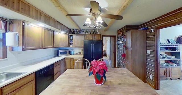 kitchen featuring wood counters, sink, ceiling fan, and black appliances