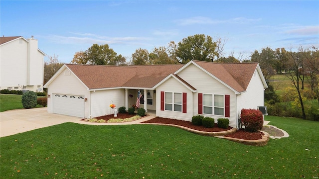 ranch-style home with cooling unit, a garage, and a front yard