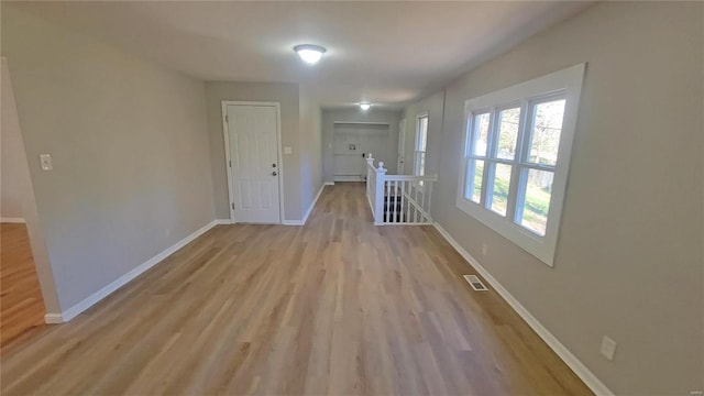 corridor featuring light hardwood / wood-style flooring