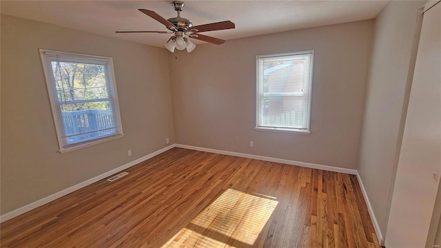 unfurnished room with ceiling fan and light hardwood / wood-style floors