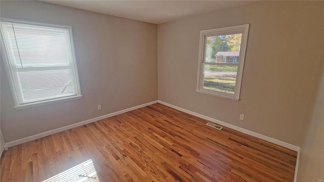 unfurnished room with light hardwood / wood-style flooring