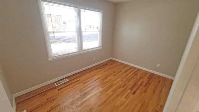 unfurnished room featuring light hardwood / wood-style floors