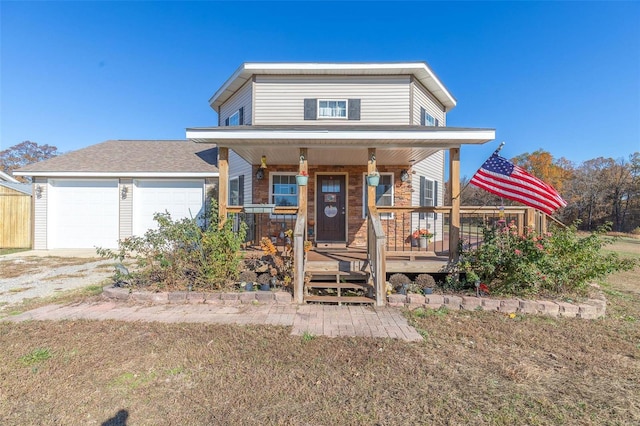 view of front facade with covered porch and a garage