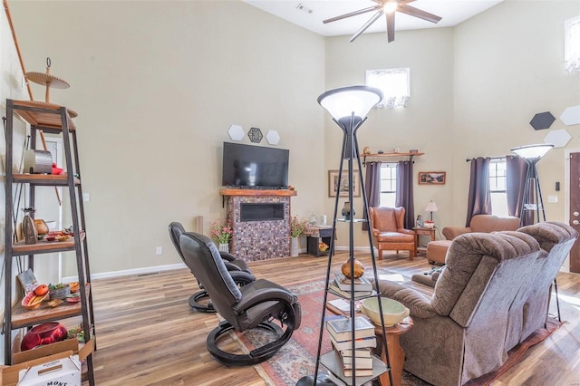 living room with hardwood / wood-style flooring and ceiling fan